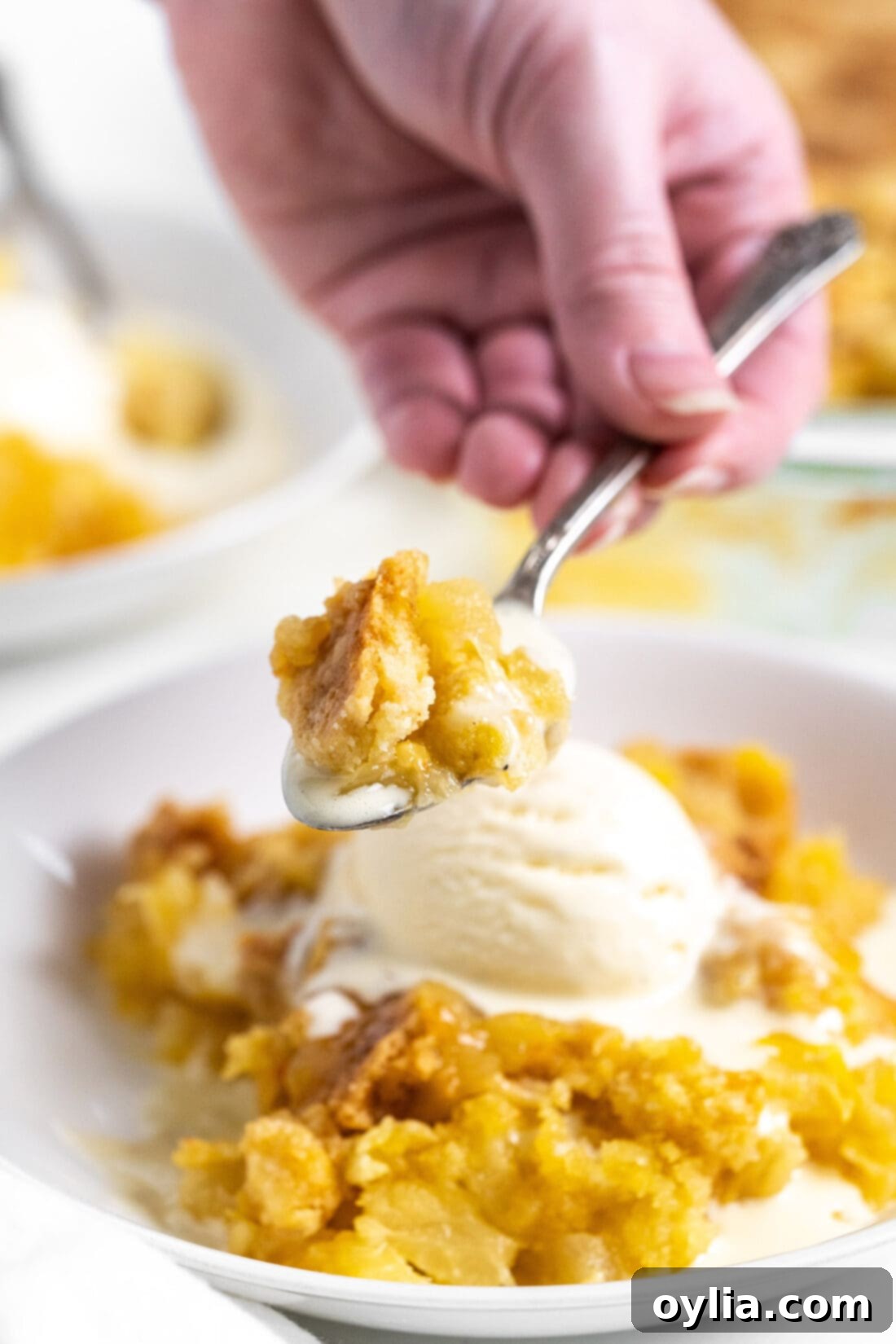 Golden Pineapple Delight 9 Close-up of a spoonful of warm Pineapple Dump Cake