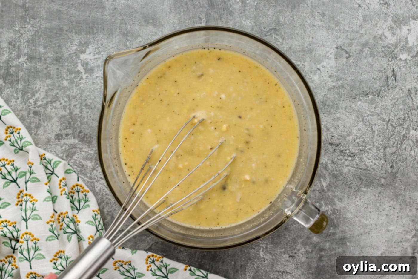 tuna casserole sauce ingredients whisked in a mixing bowl until smooth