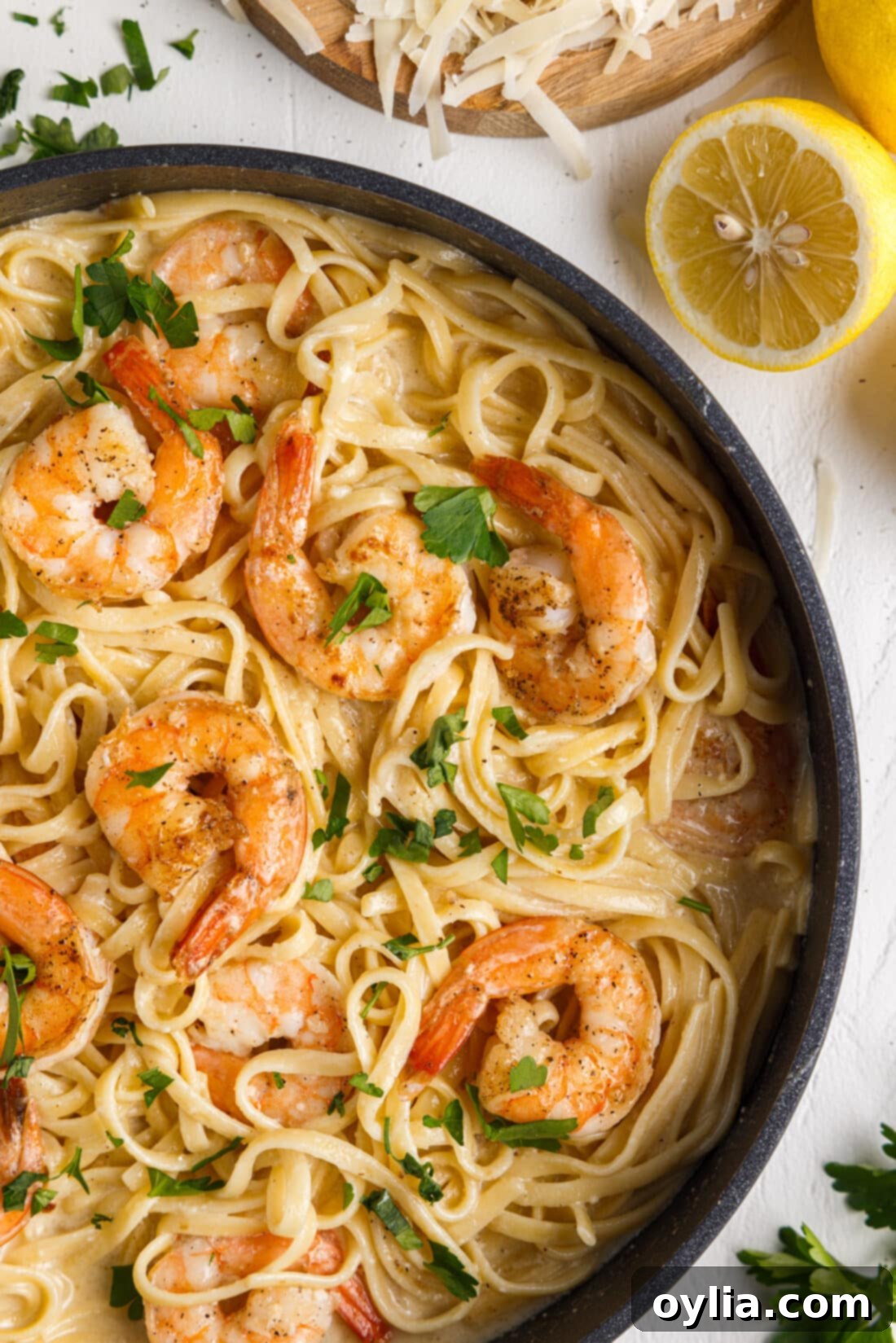 Zesty Garlic Shrimp Pasta 2 Shrimp Pasta in a skillet, showcasing rich creamy sauce and plump shrimp.
