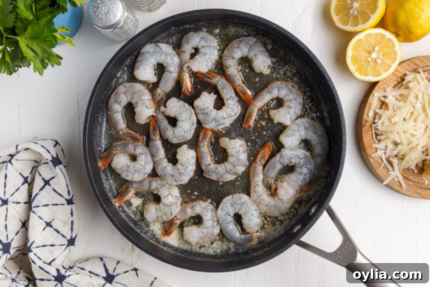 raw shrimp in a frying pan
