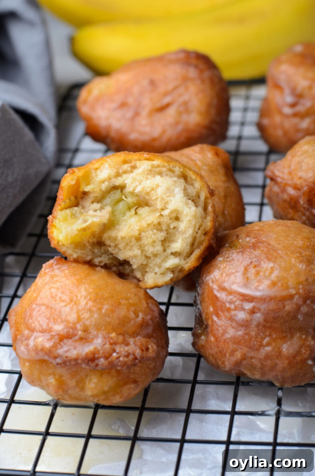 Bite out of a Banana Fritter, showing fluffy interior