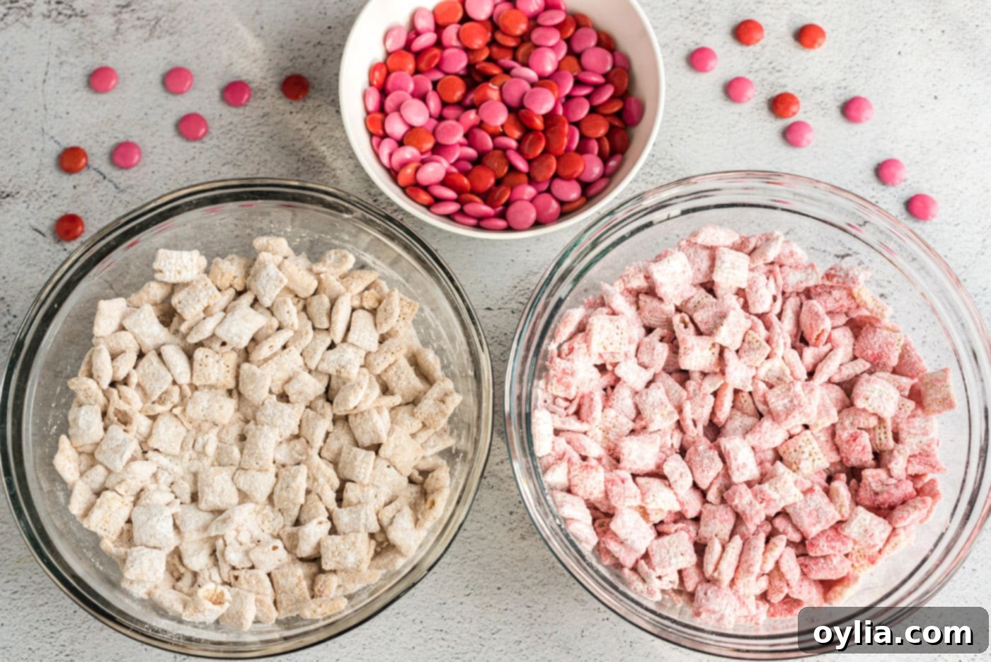 white and pink muddy buddies with m&ms