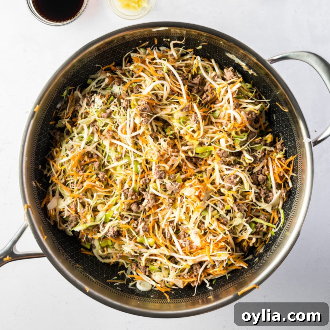 Egg roll in a bowl ingredients cooking in a skillet