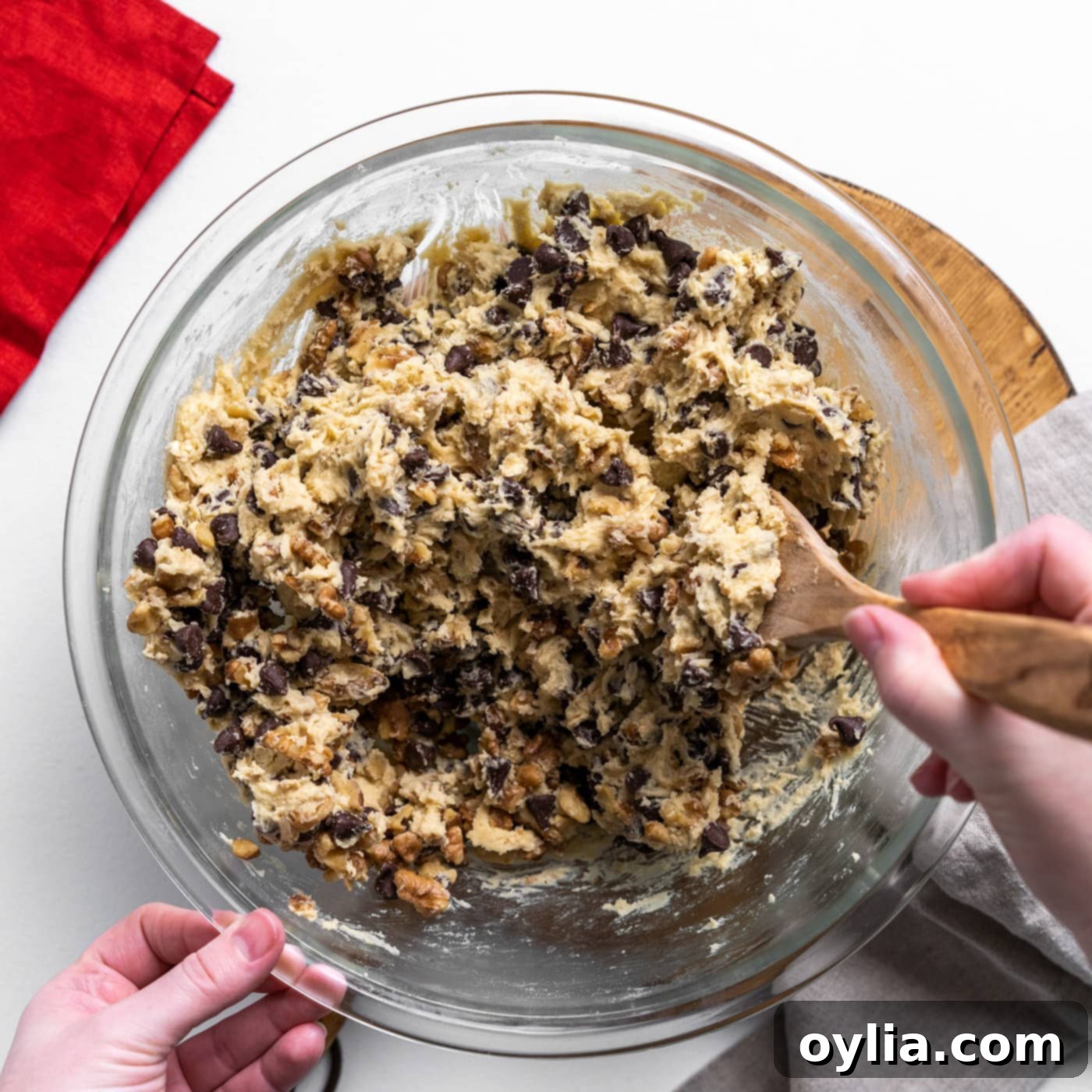 Close-up of cookie dough with chocolate chips and walnuts fully incorporated