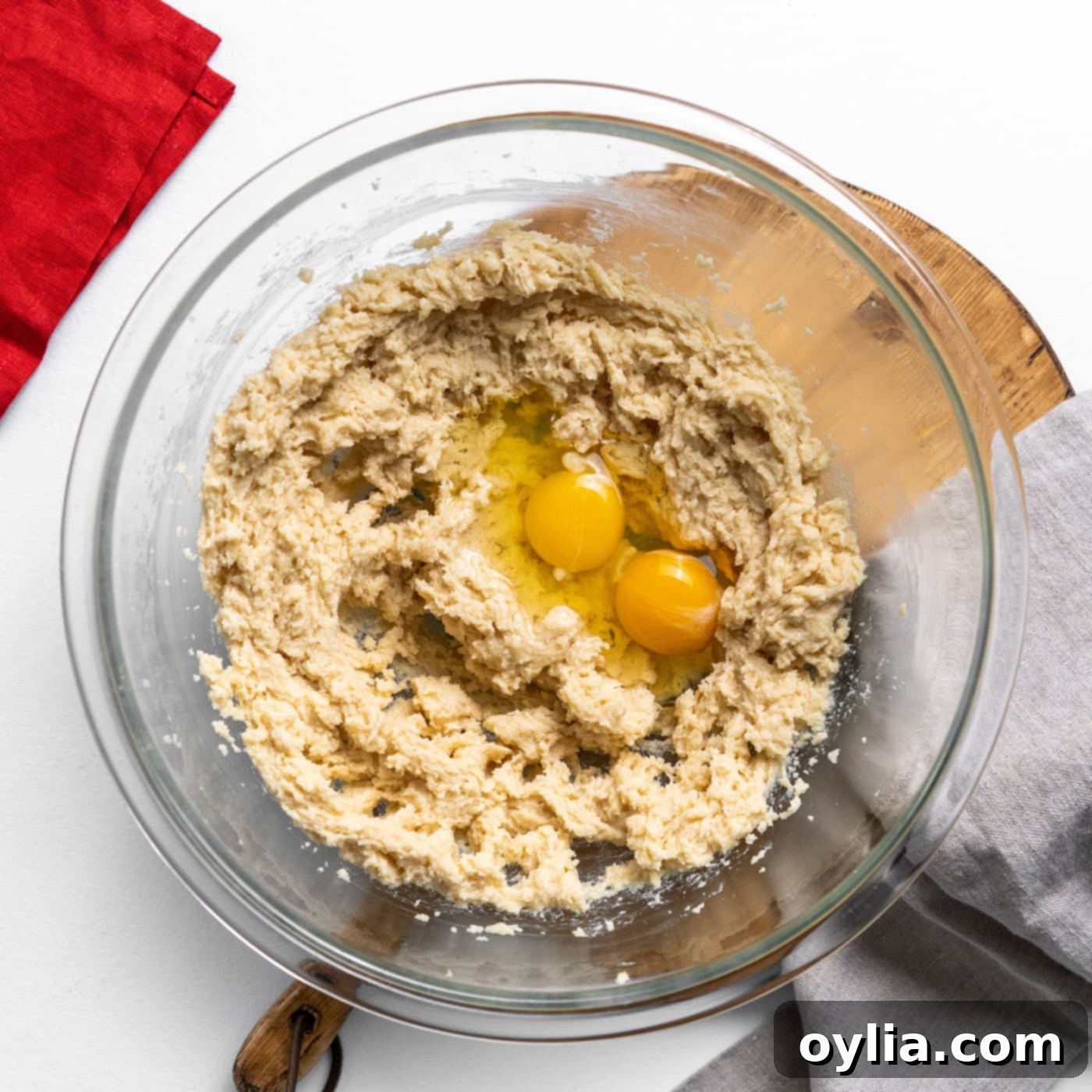 Adding eggs to the creamed butter and sugar mixture for Doubletree cookies