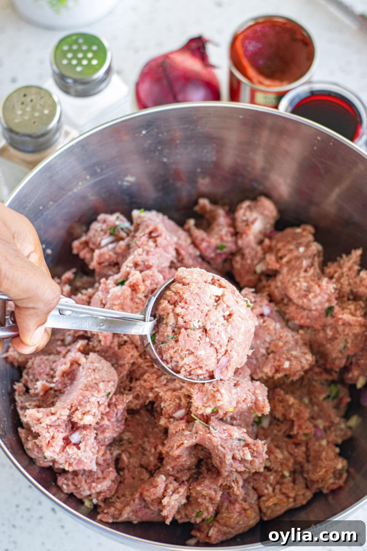 Classic Spaghetti and Meatballs 7 using a cookie scoop to create meatballs