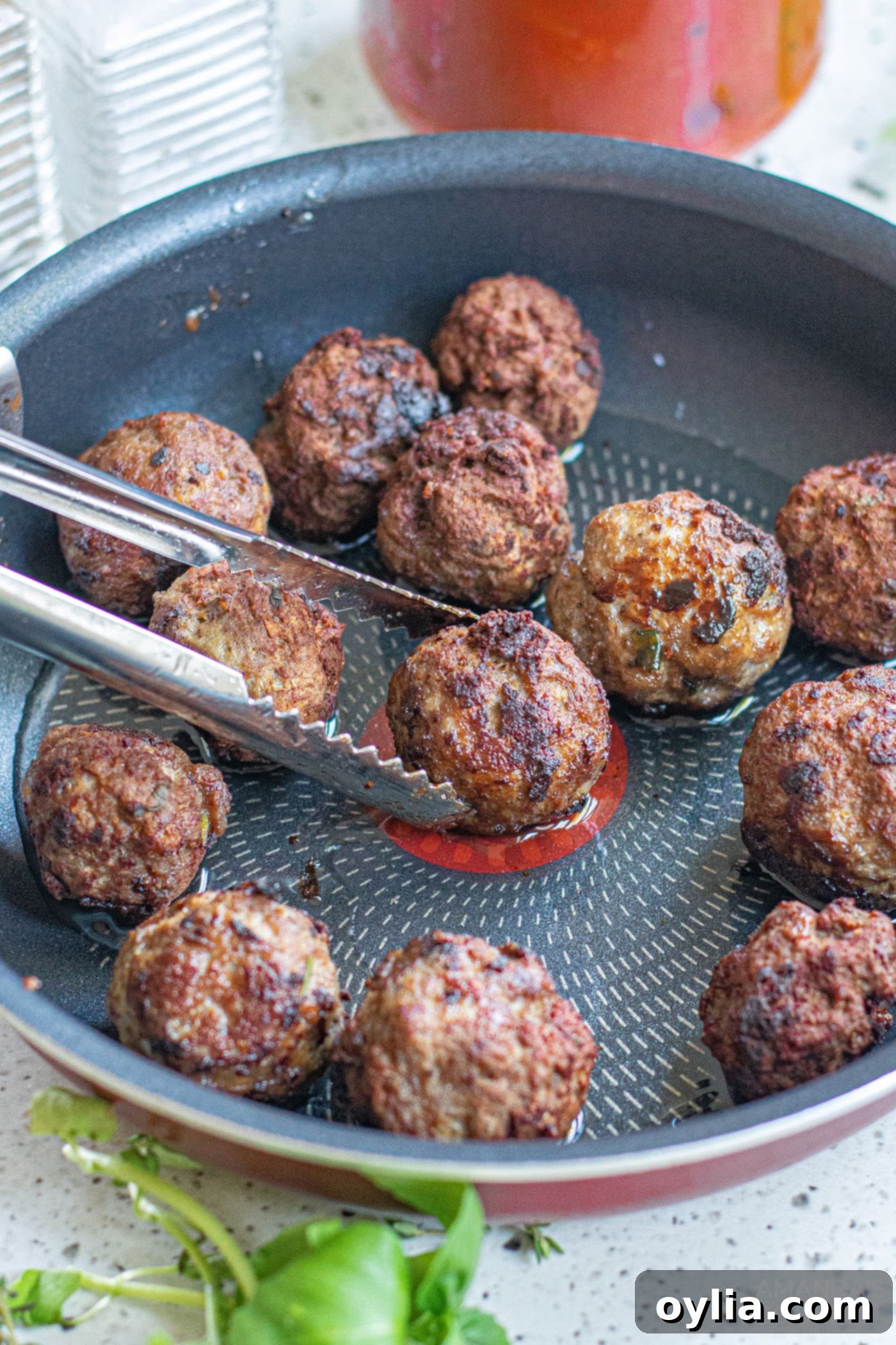 Classic Spaghetti and Meatballs 8 browning meatballs on a skillet