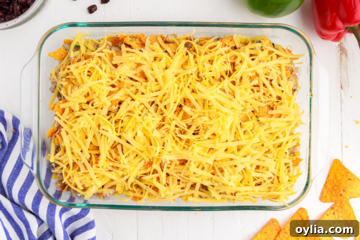 shredded cheese over ground beef dorito casserole