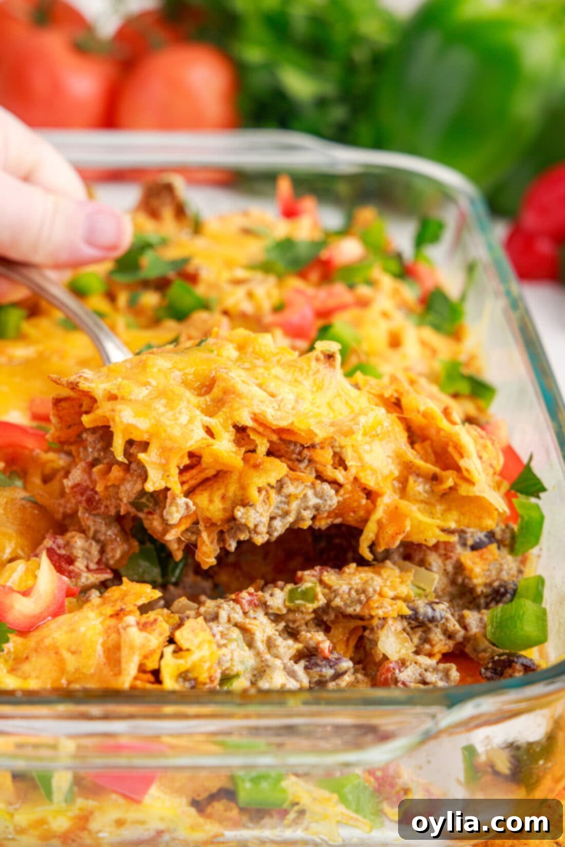 LIFTING OUT A SERVING OF Dorito Casserole