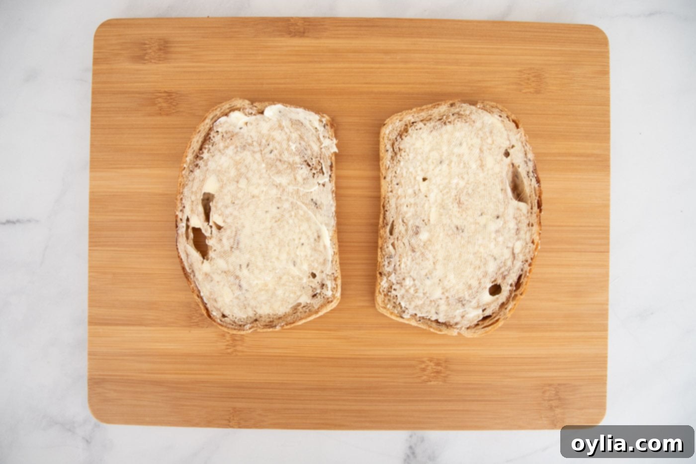 buttered rye bread on cutting board