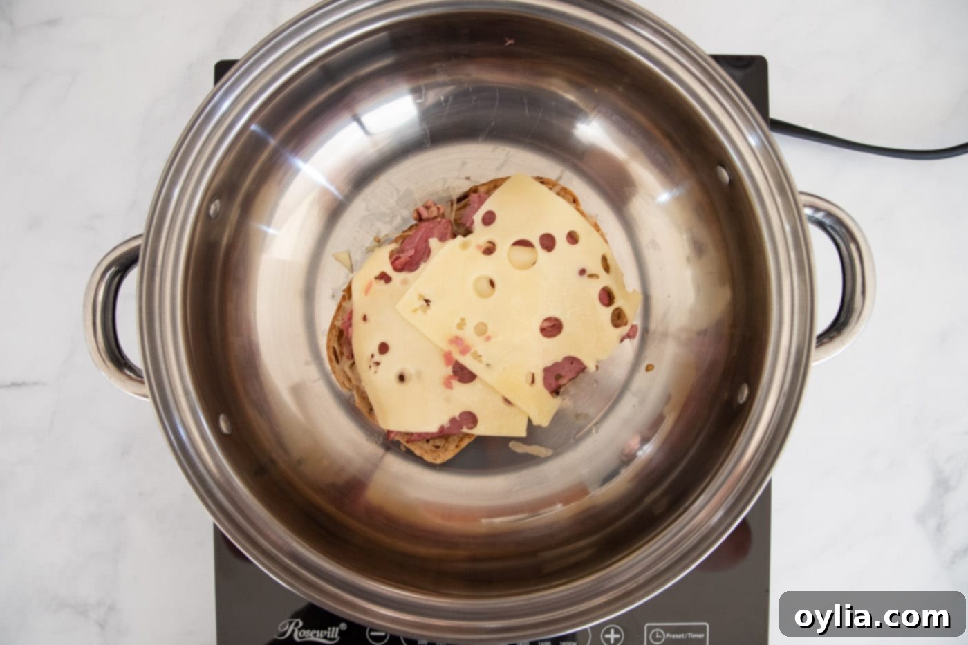 corned beef with cheese in a skillet