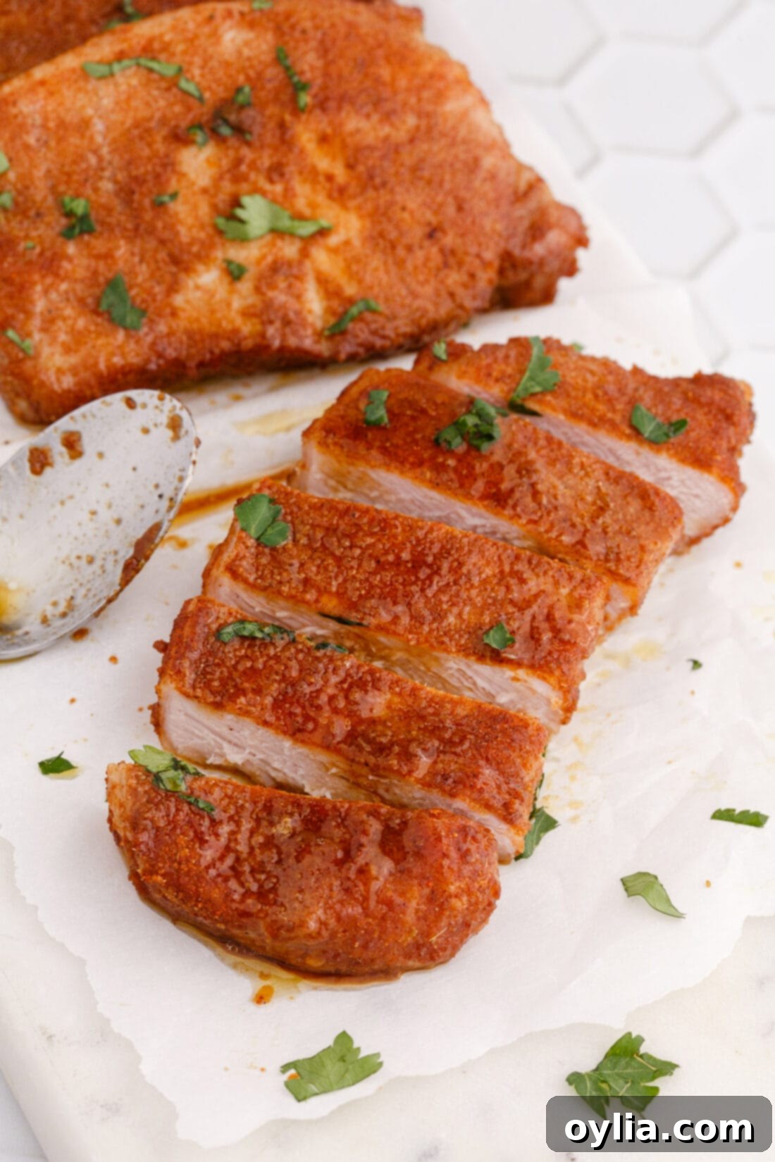 sliced Baked Pork Chop revealing its juicy interior