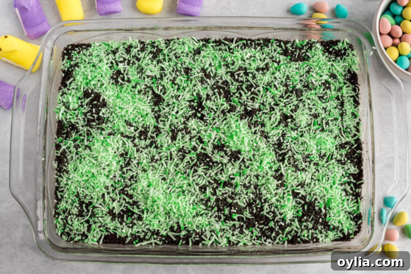 shredded coconut on top of easter dirt cake
