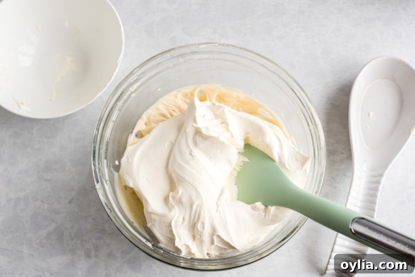 folding cool whip into cream cheese mixture