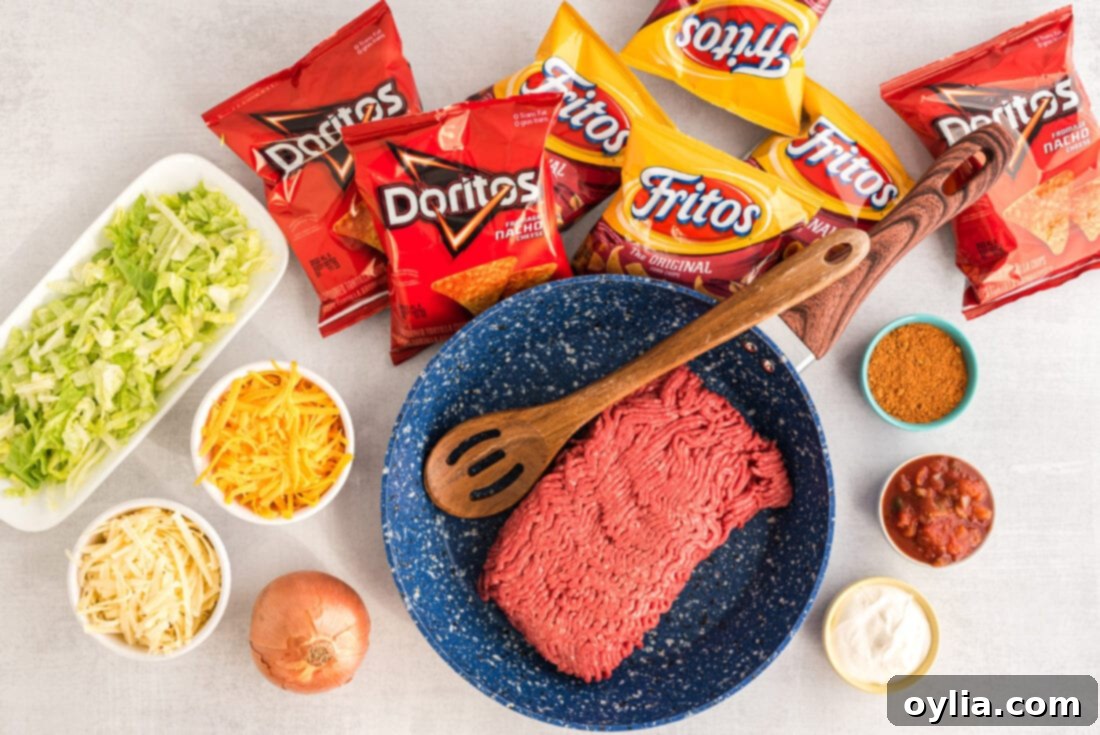 A collection of ingredients for Walking Tacos, including ground beef, seasoning, chips, and various toppings.