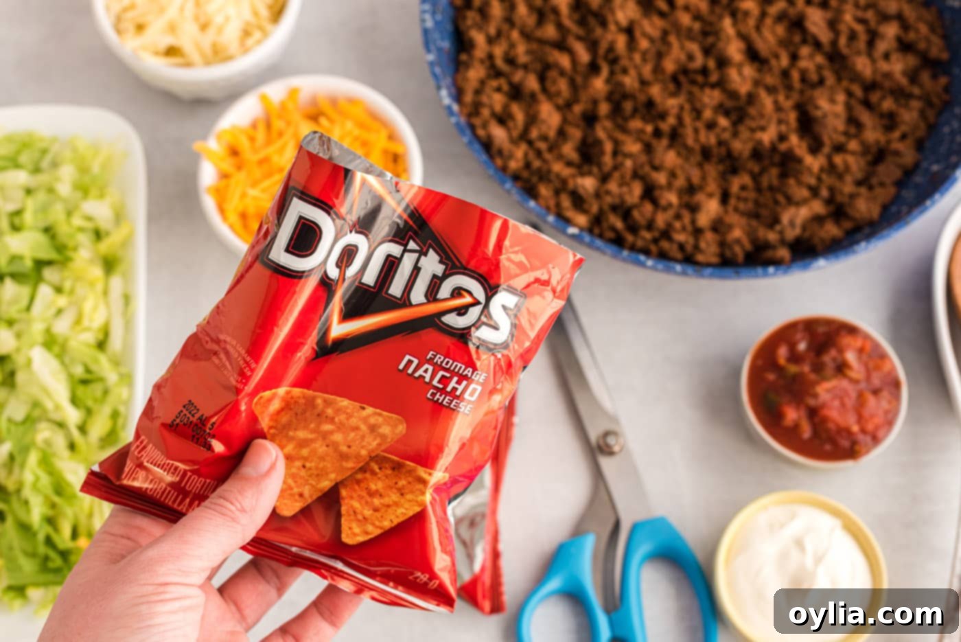 A chip bag with the top neatly cut off, ready for fillings.