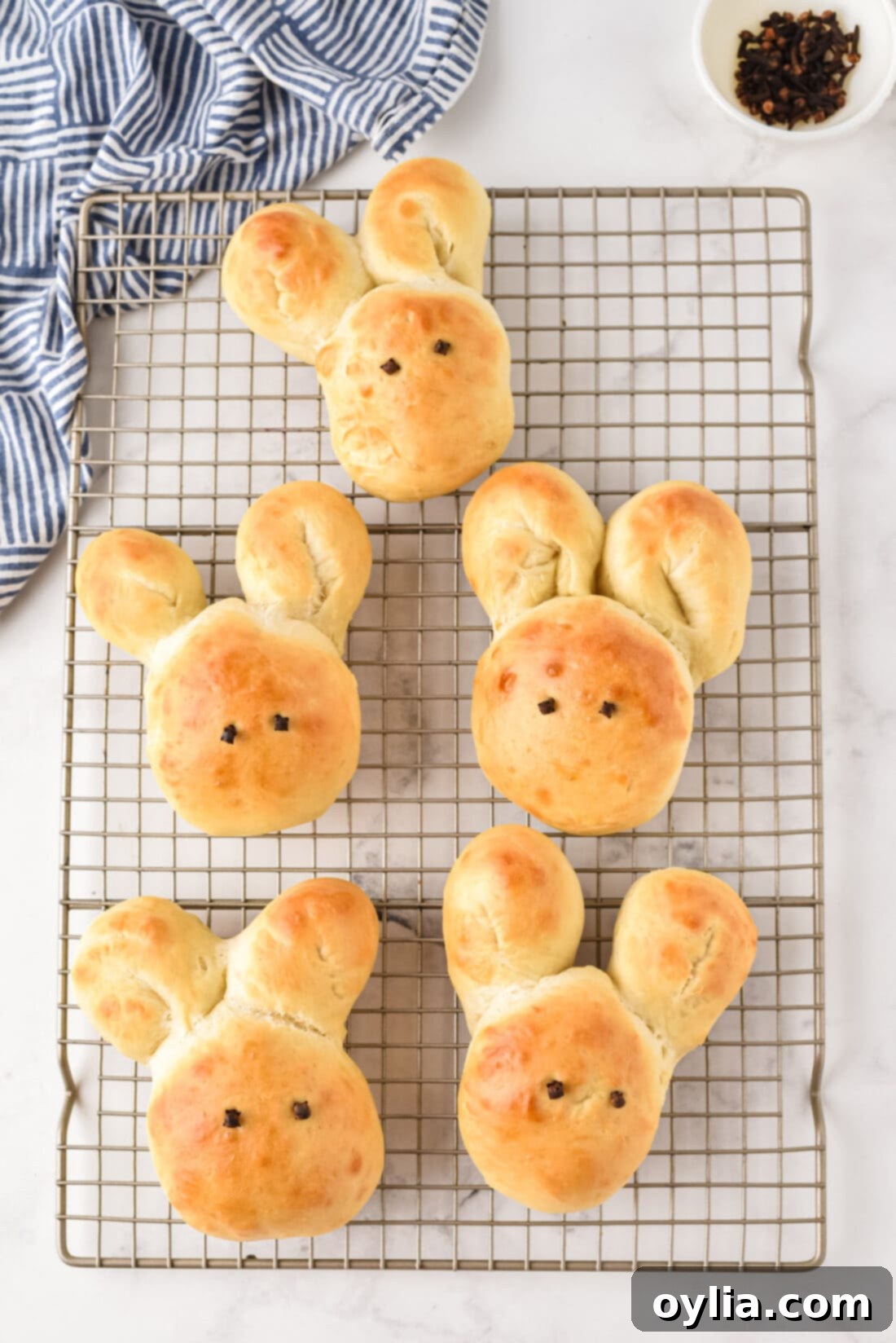 Freshly baked Bunny Rolls cooling on a wire rack, golden brown and perfectly shaped.