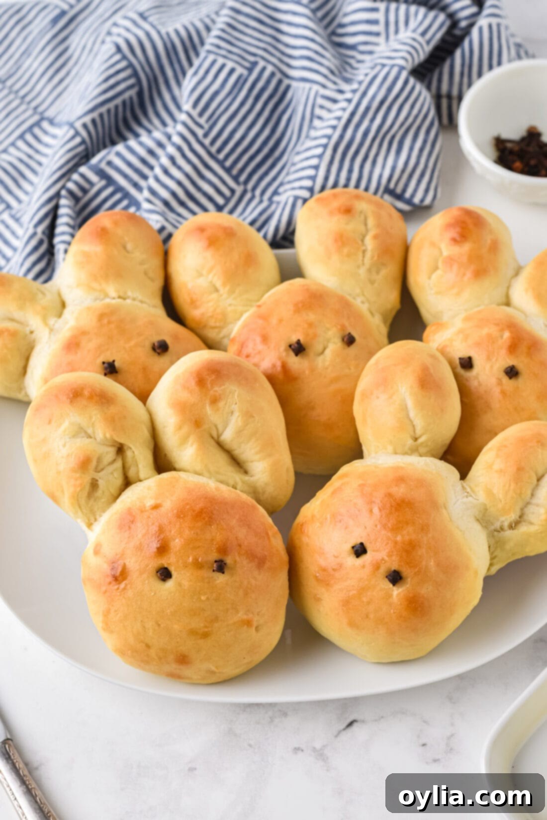 A plate full of beautifully arranged Bunny shaped Rolls, ready for Easter dinner.