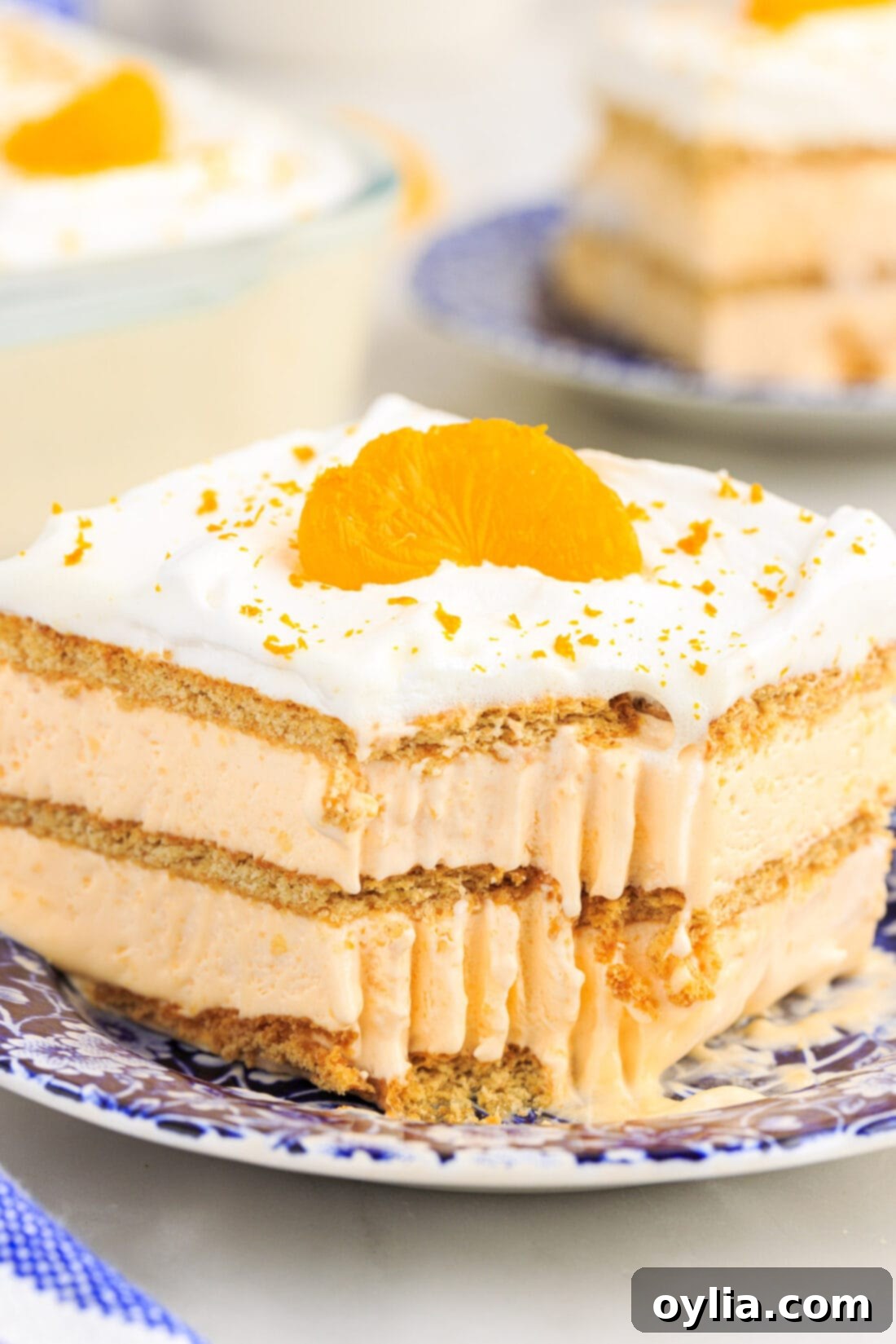 slice of Orange Icebox Cake with bite out of it