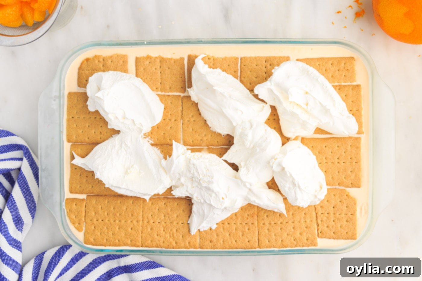 whipped cream on top of orange icebox cake