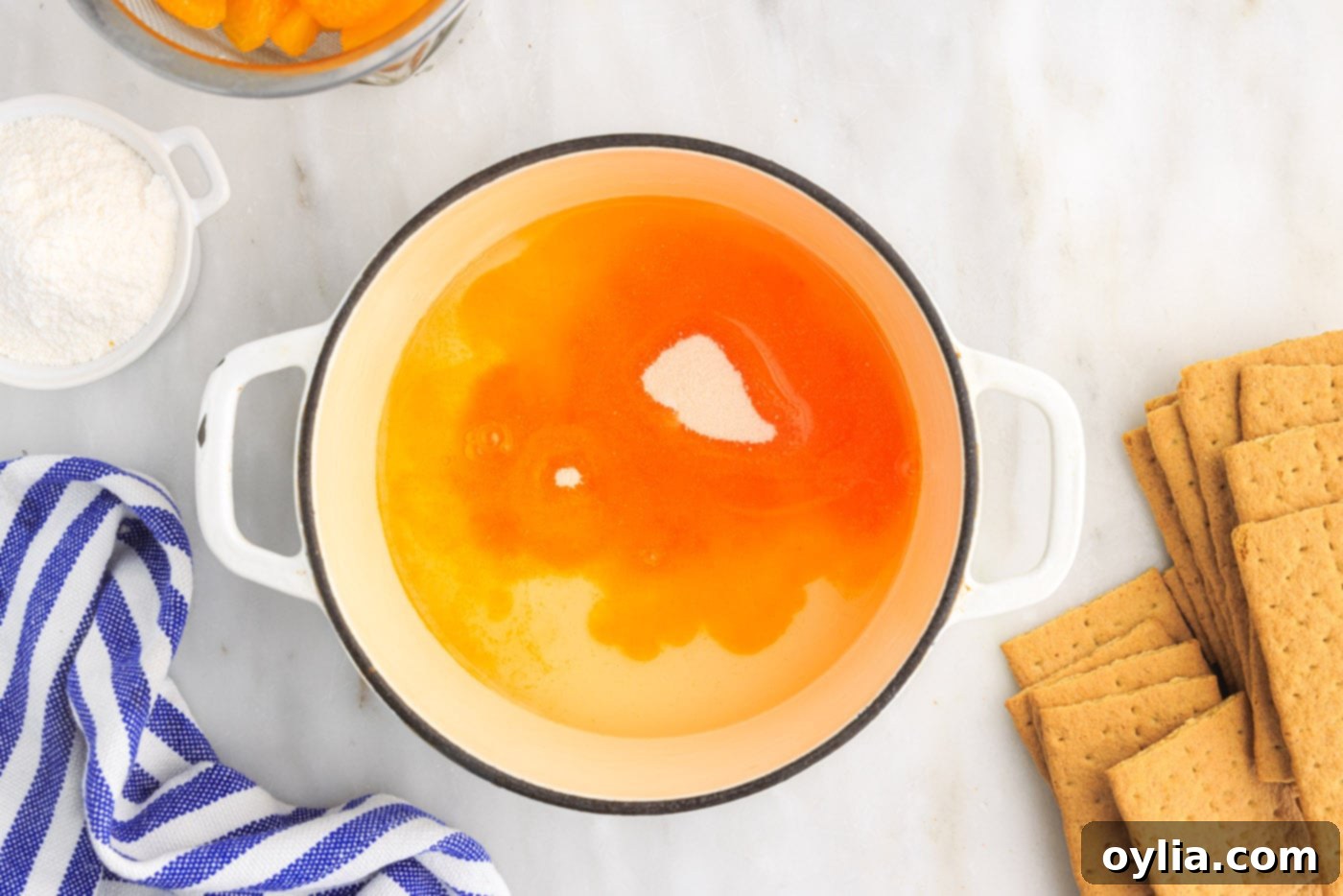 mandarin orange juice with vanilla pudding in saucepan