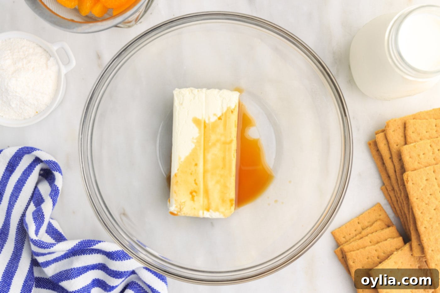 cream cheese and vanilla extract in mixing bowl