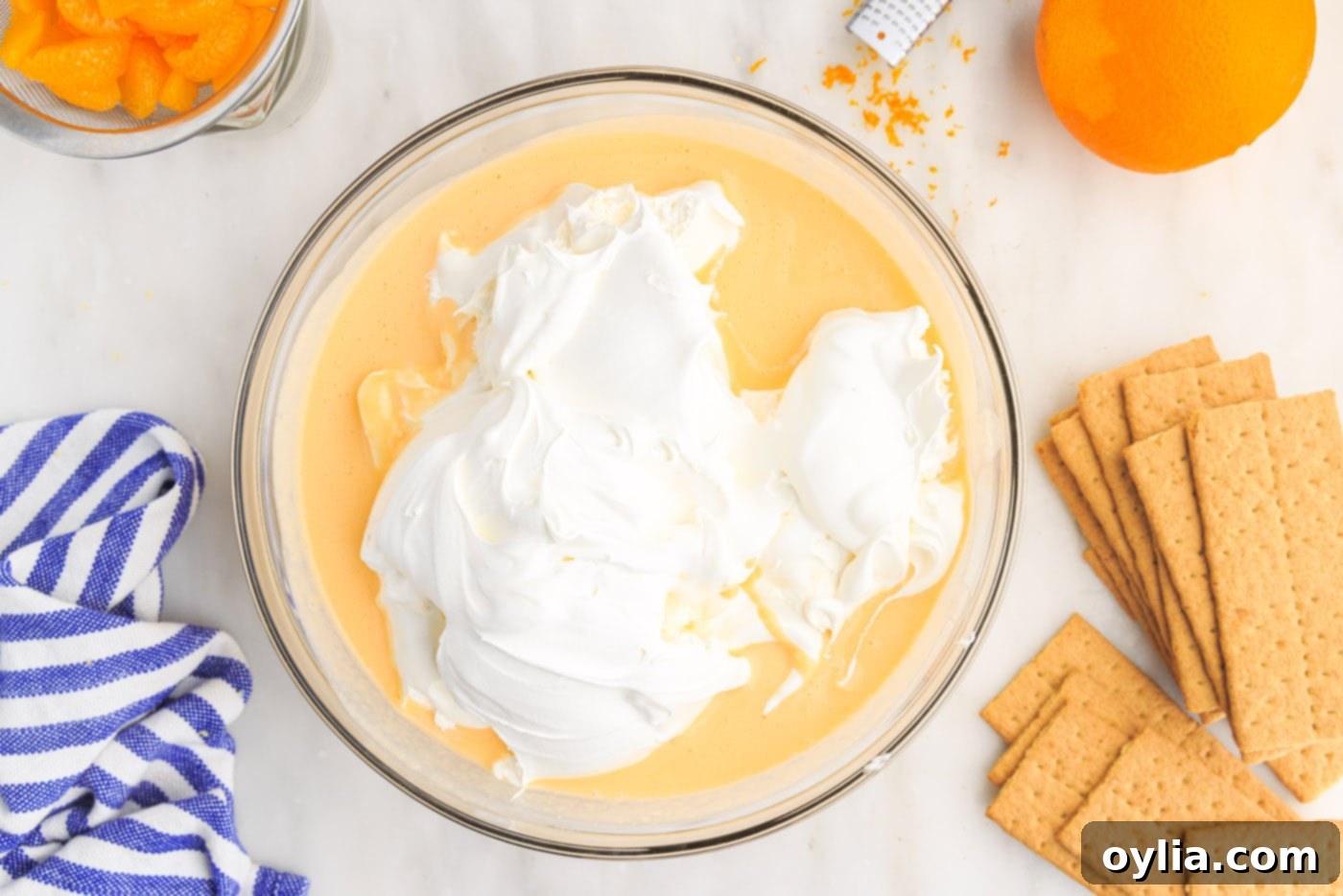 cool whip on top of pudding mix in a bowl