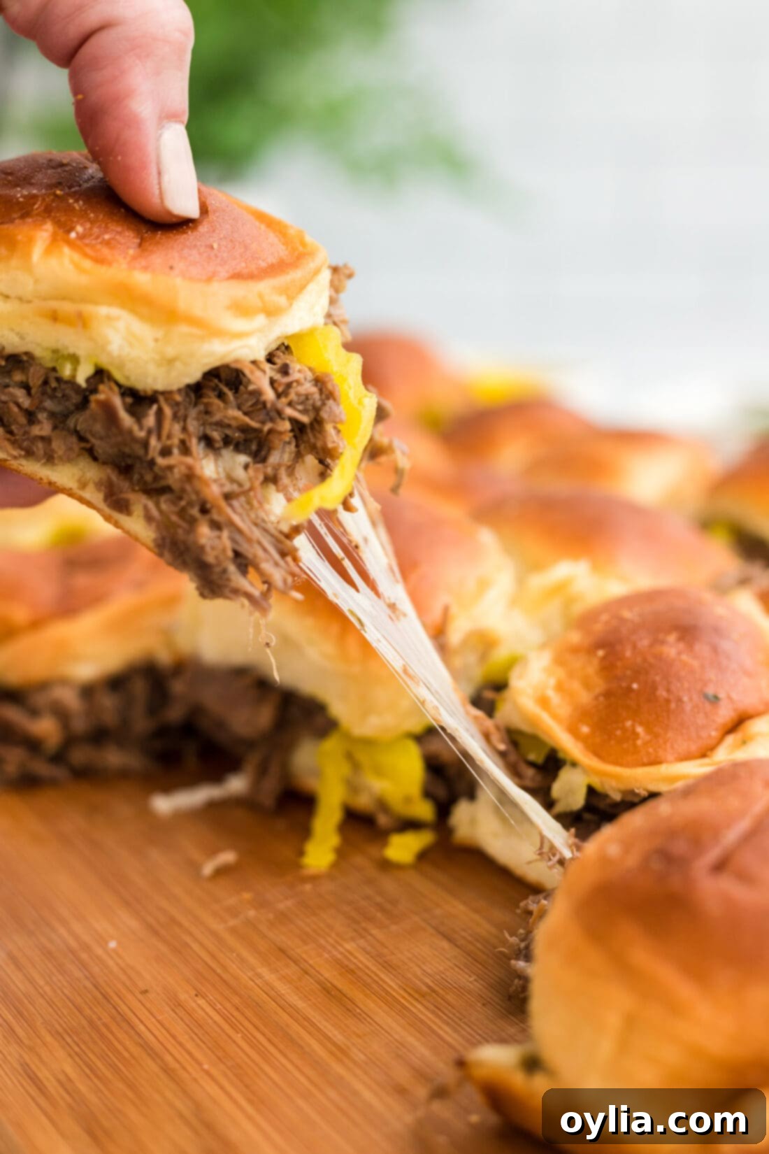 Homestyle Mississippi Pot Roast Sliders 3 lifting a Mississippi Pot Roast Slider from pan