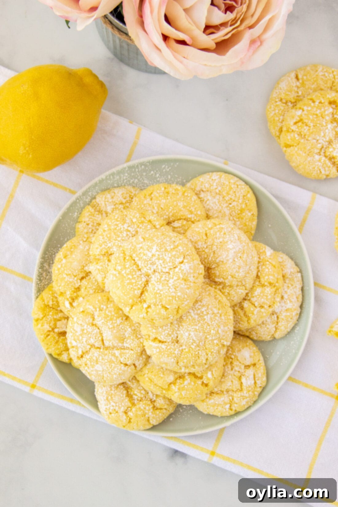 A beautifully arranged plate of freshly baked lemon cake mix cookies, ready to be enjoyed as a refreshing dessert