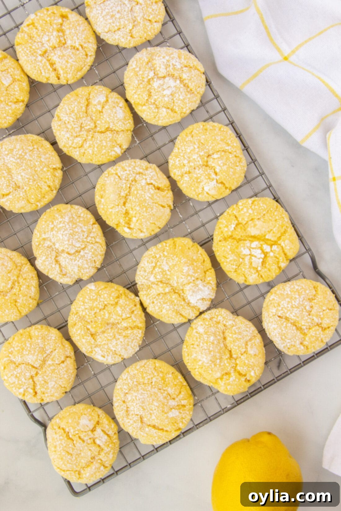 Freshly baked lemon cake mix cookies cooling on a wire rack, ready to be enjoyed