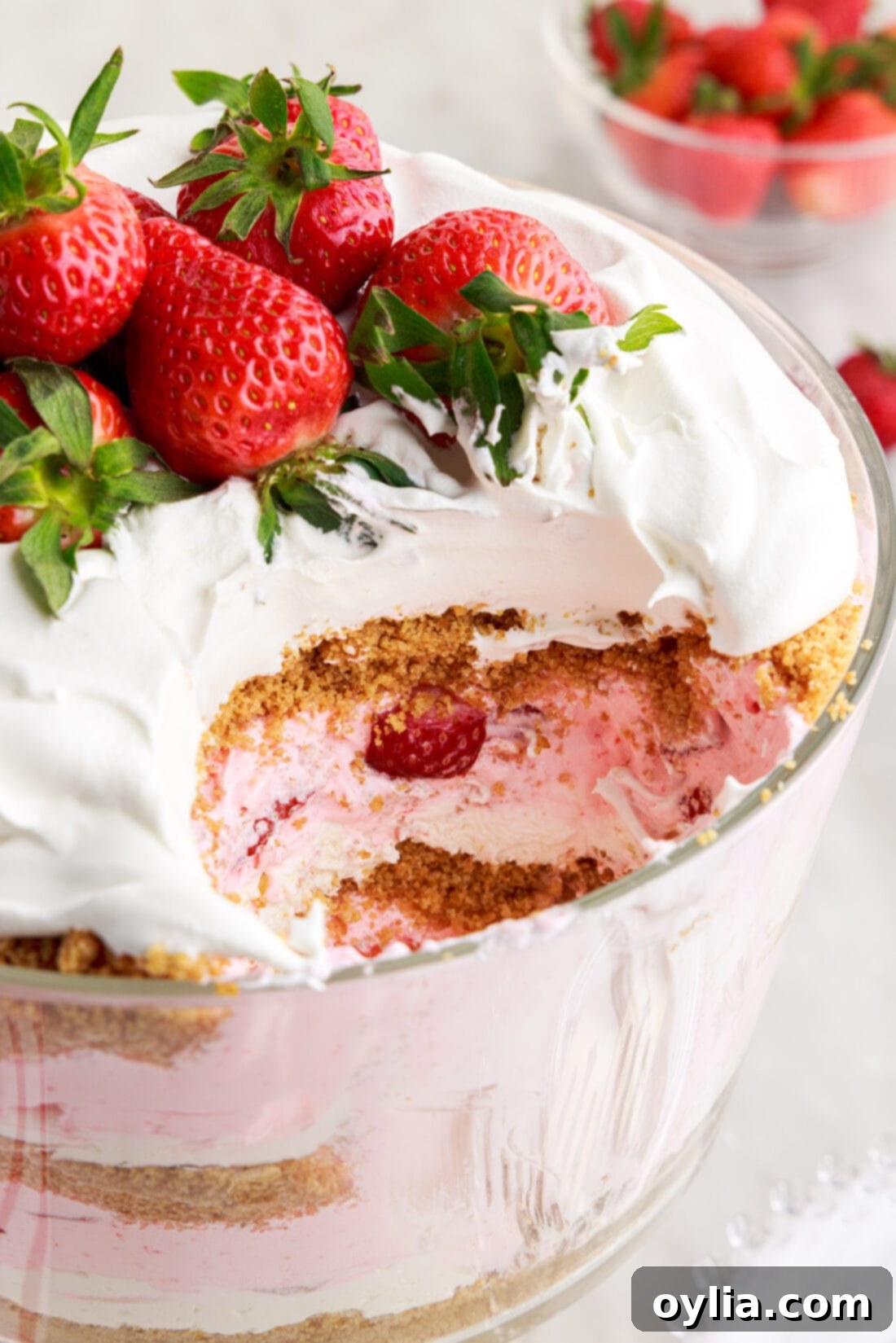 Strawberry Lasagna Trifle 16 Strawberry Lasagna Trifle with spoon full removed