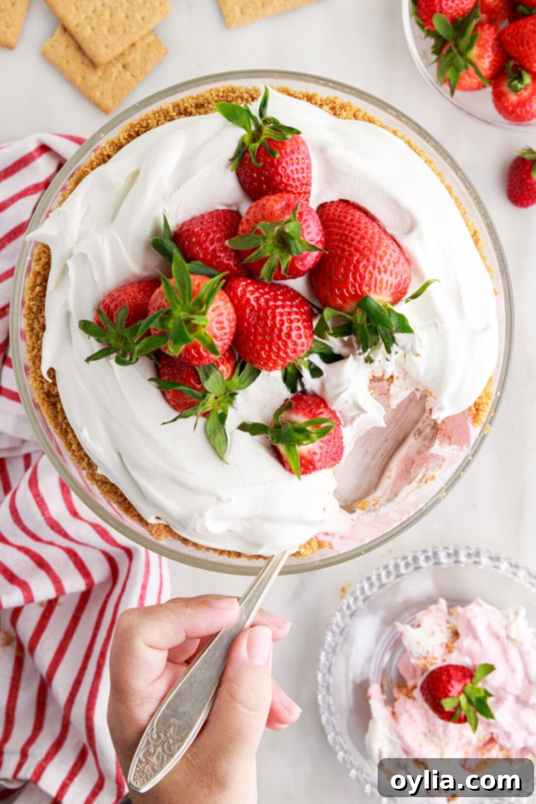 Strawberry Lasagna Trifle 3 over head view of trifle with a spoonful removed