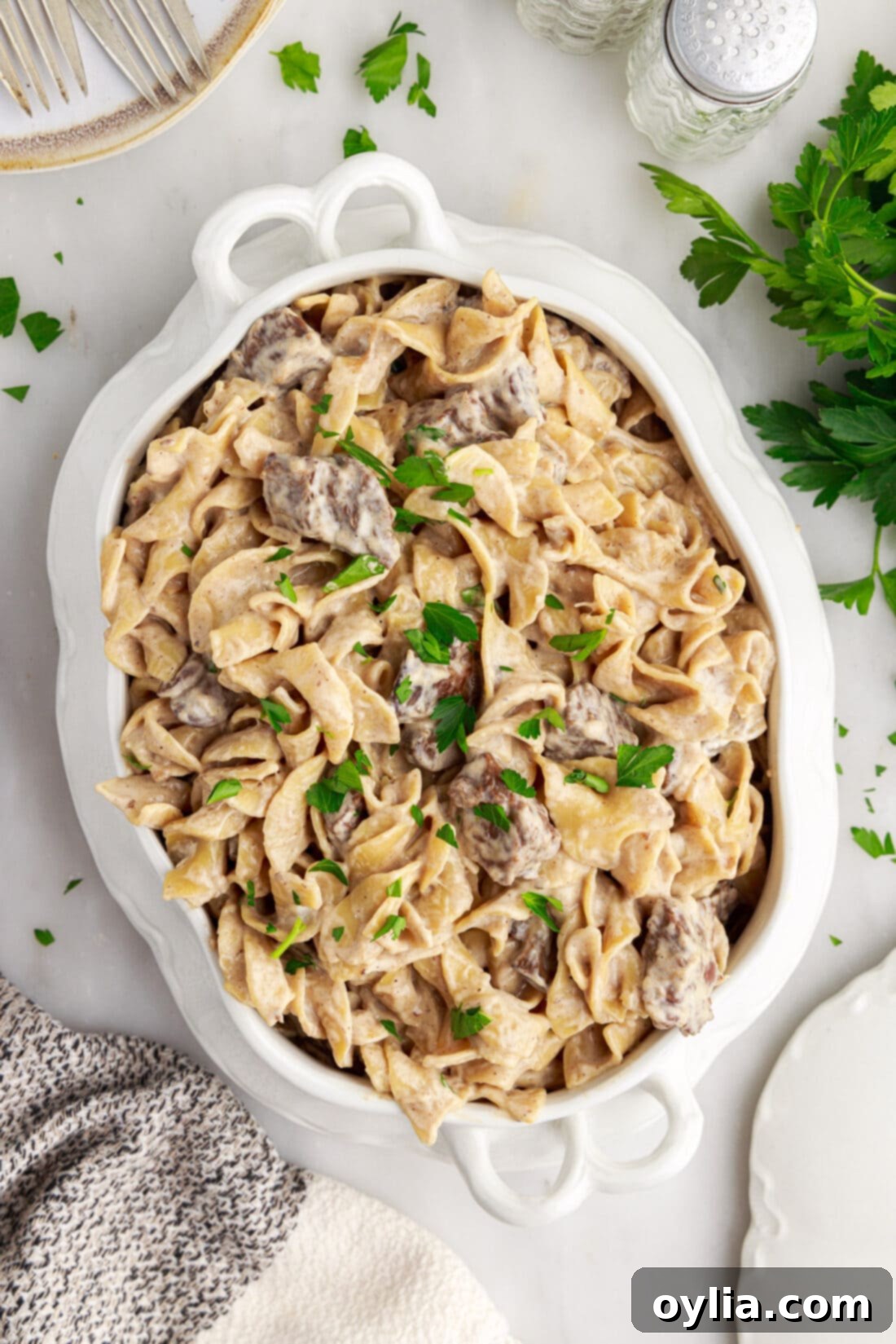 overhead of Instant Pot Beef Stroganoff in a casserole serving dish, ready to eat