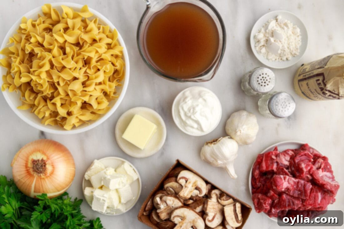 Instant Pot Beef Stroganoff ingredients laid out on a cutting board