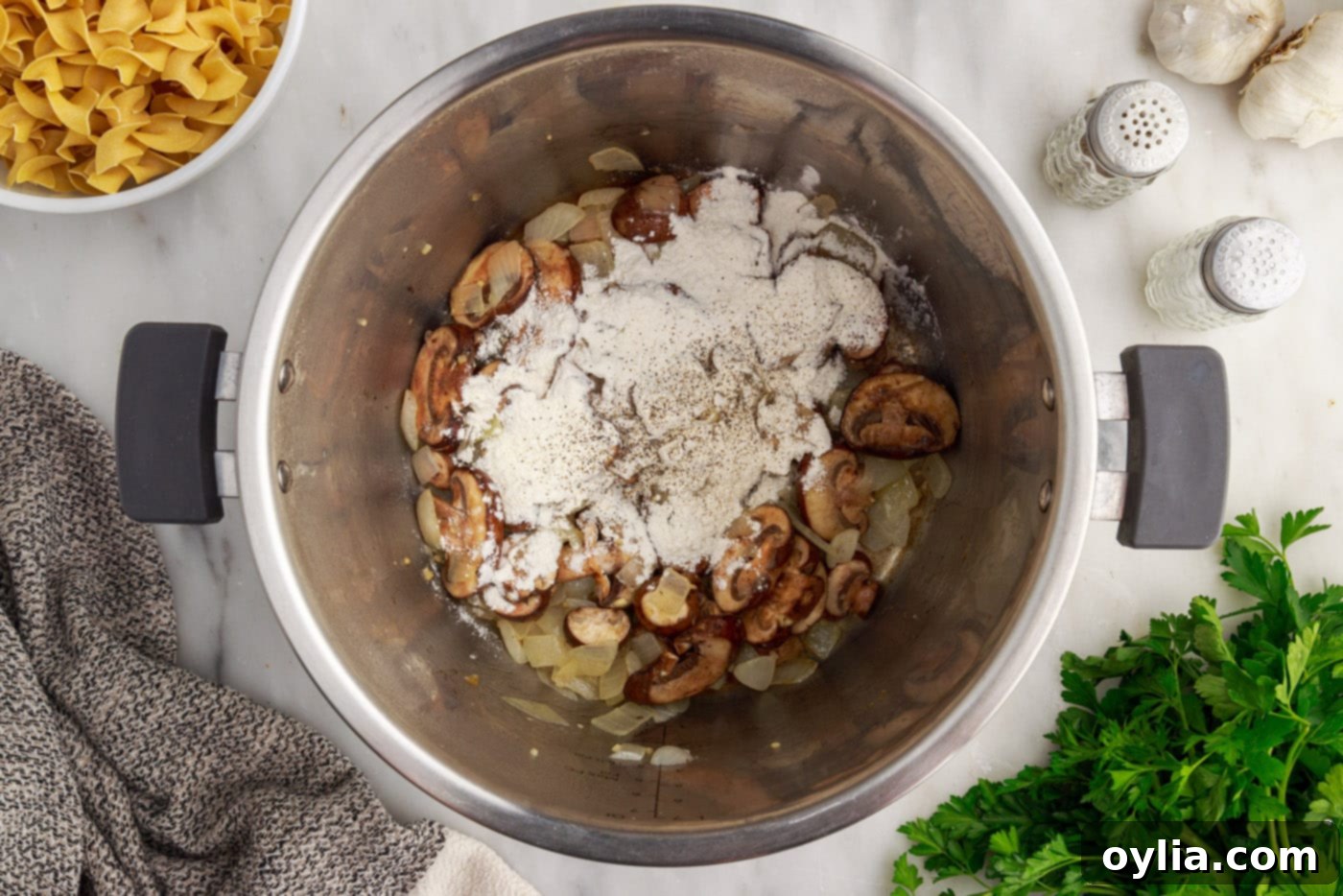 flour over the top of mushrooms and onions in instant pot