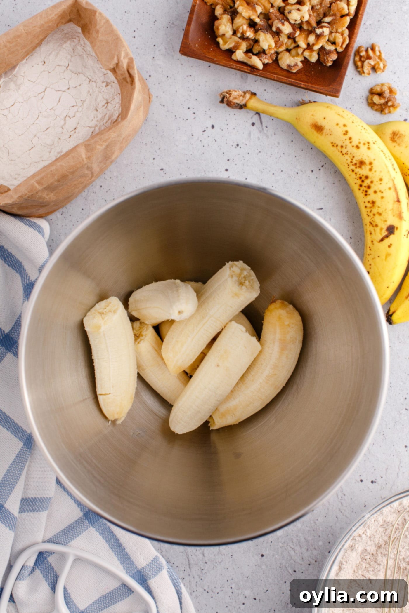 mashed bananas in a mixing bowl