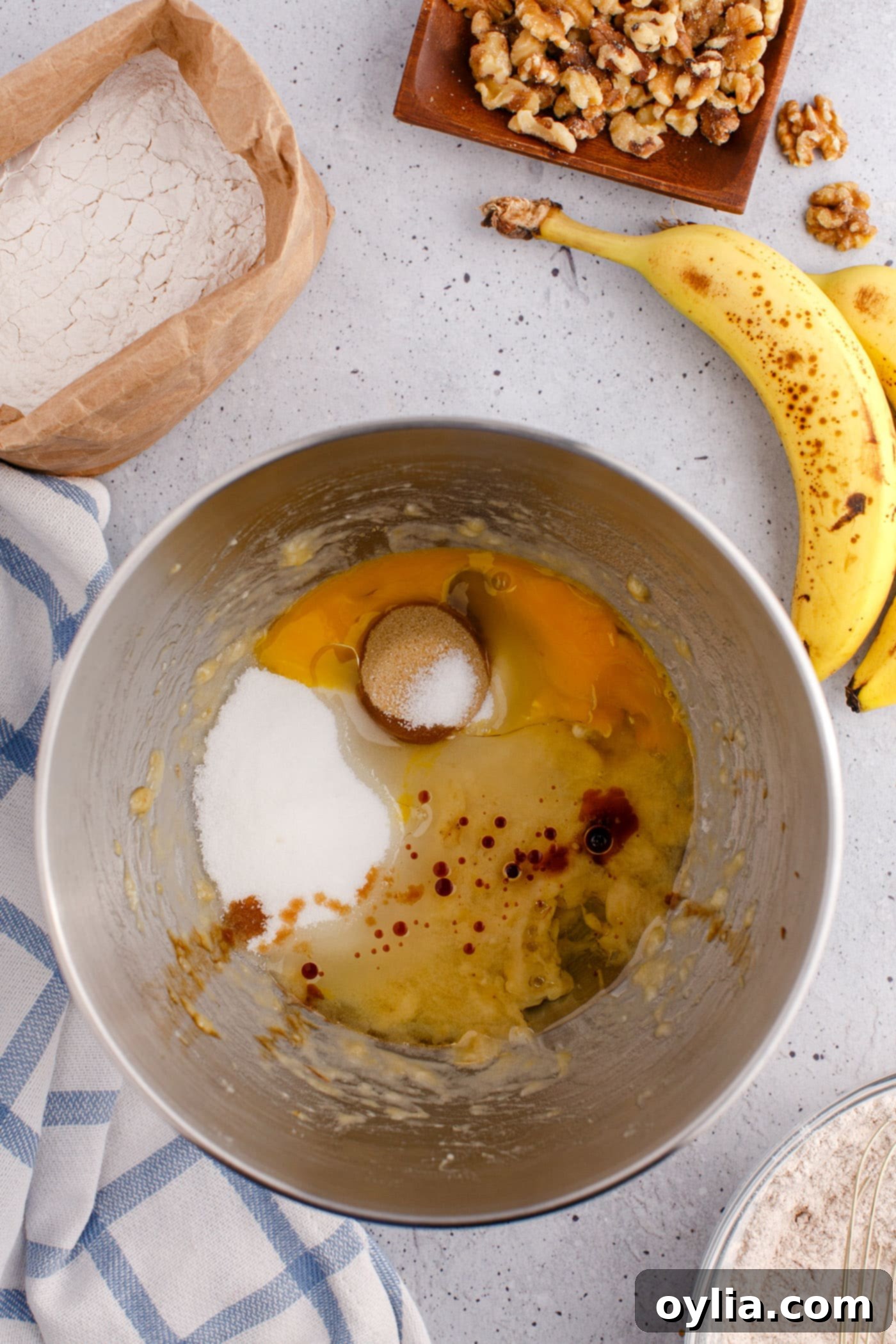 wet ingredients for banana nut bread in a mixing bowl