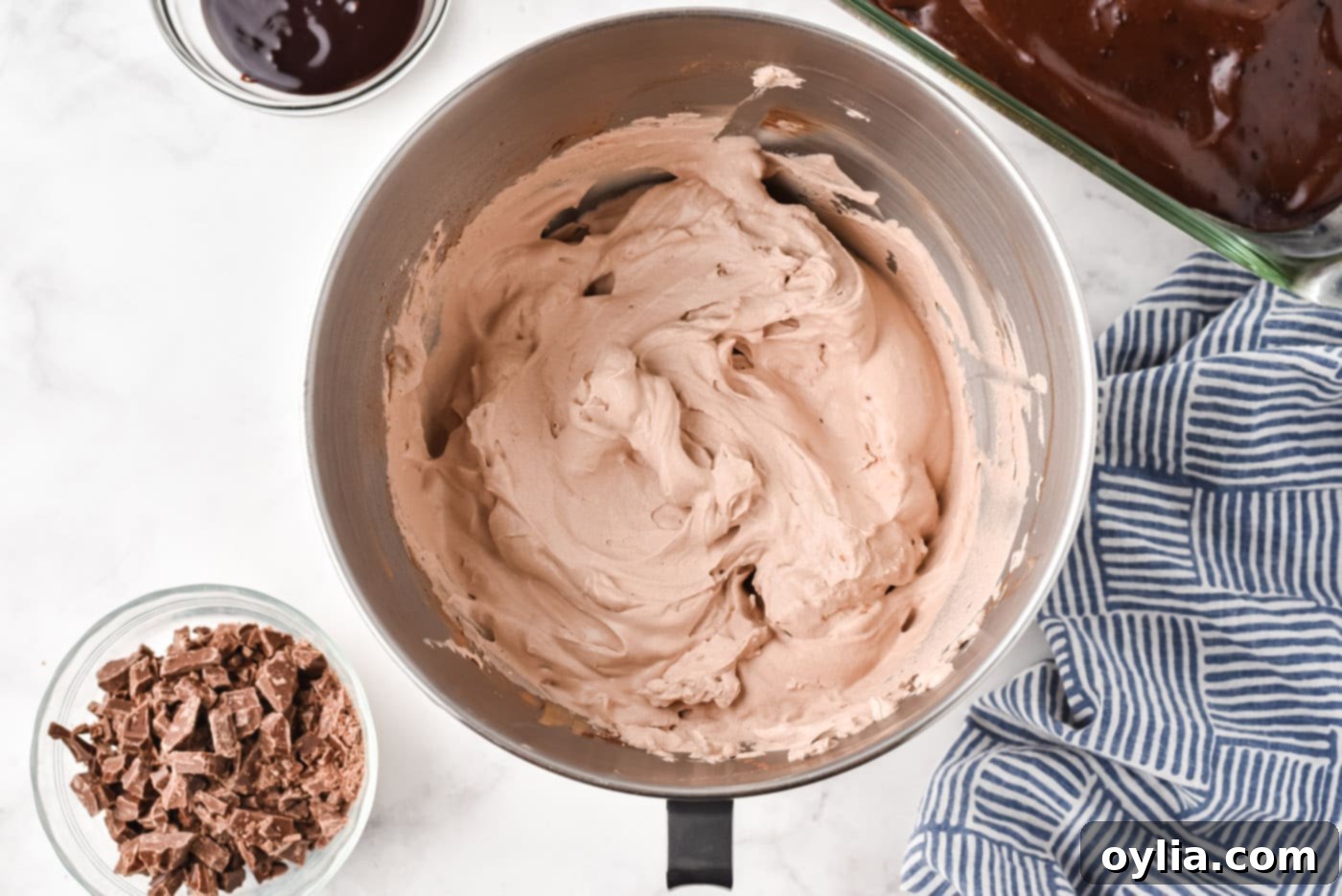 fluffy homemade chocolate whipped topping in a cold mixing bowl, ready to be spread
