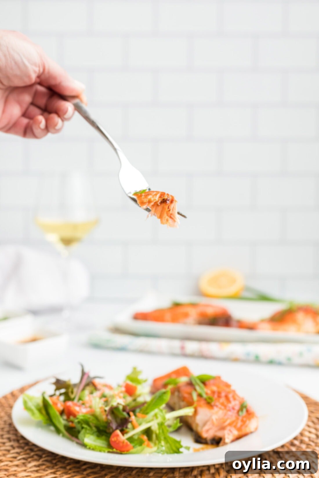 Close-up of a fork holding a piece of Maple Soy Salmon