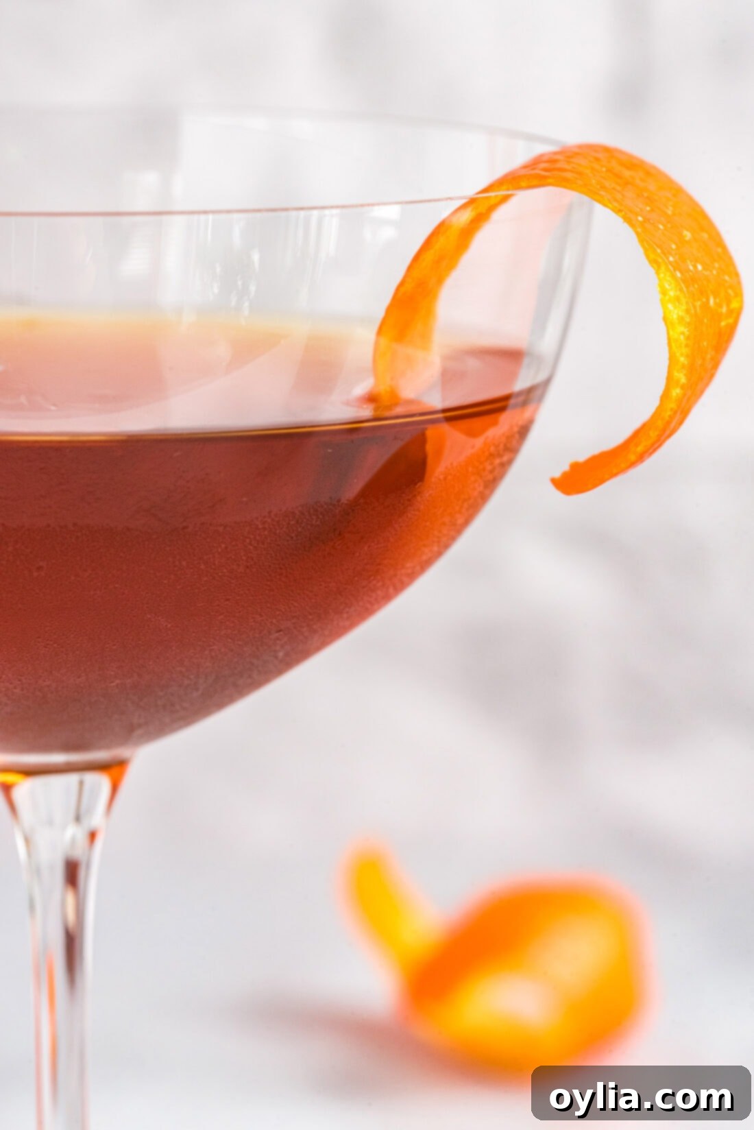 Close-up photo of a beautifully crafted Manhattan cocktail in a chilled glass