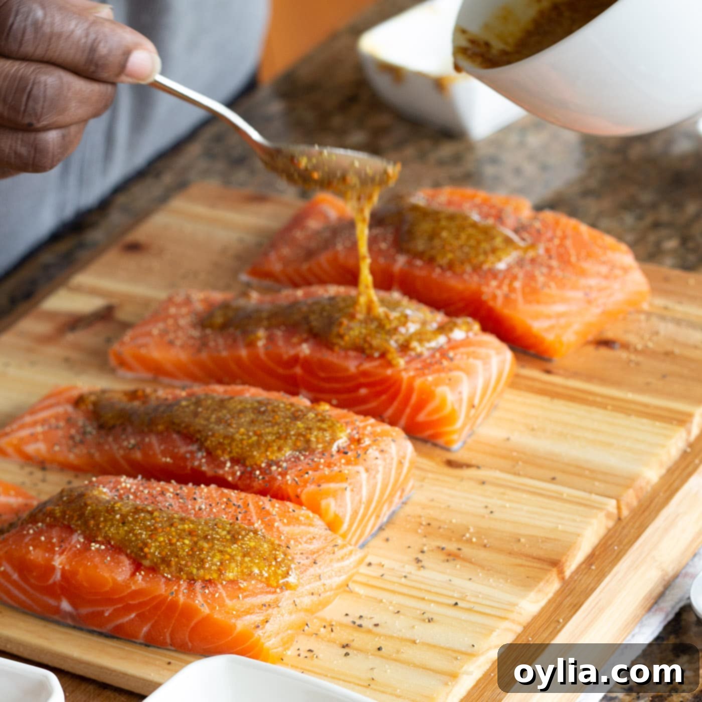 seasoning salmon with mustard, honey, and brown sugar