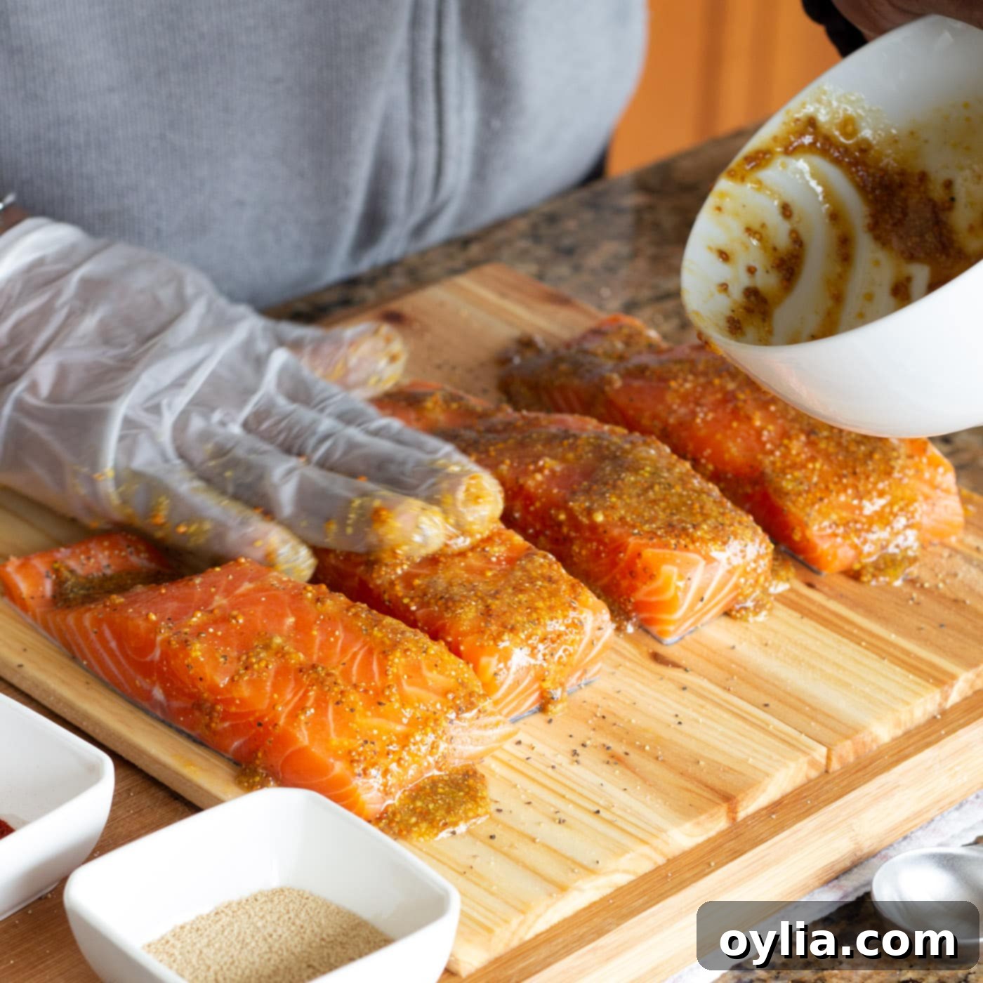 rubbing salmon filets with marinade