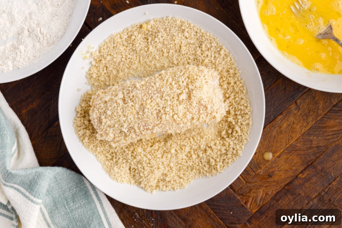 dredging rolled chicken in panko