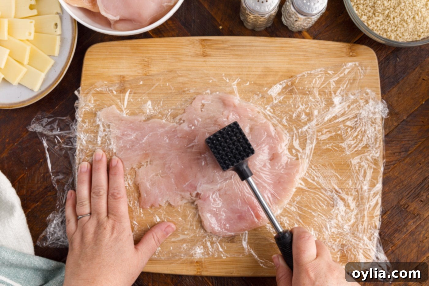 pounding chicken breast with meat tenderizer