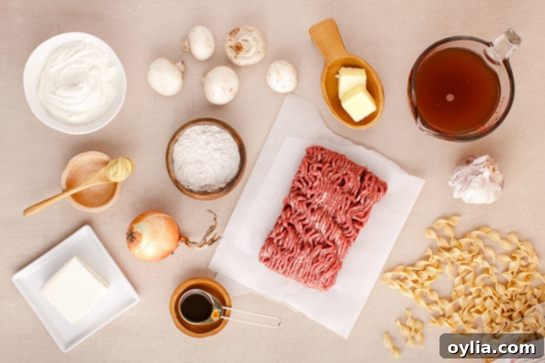 Ground Beef Stroganoff ingredients arranged on a cutting board