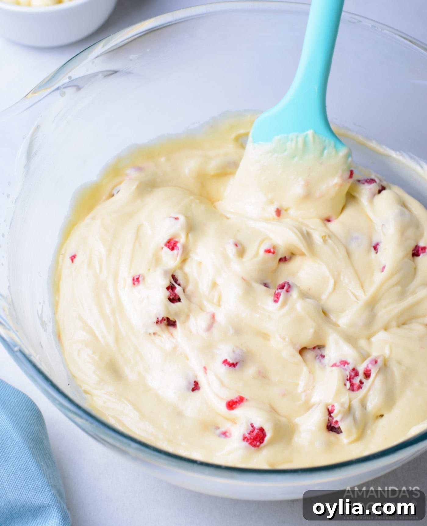 cupcake batter with raspberries