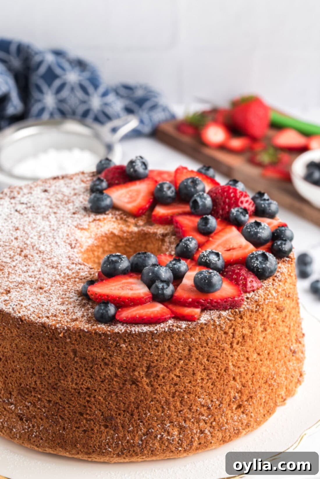 Heavenly Homemade Angel Food Cake 14 Angel Food Cake topped with powdered sugar and fresh berries