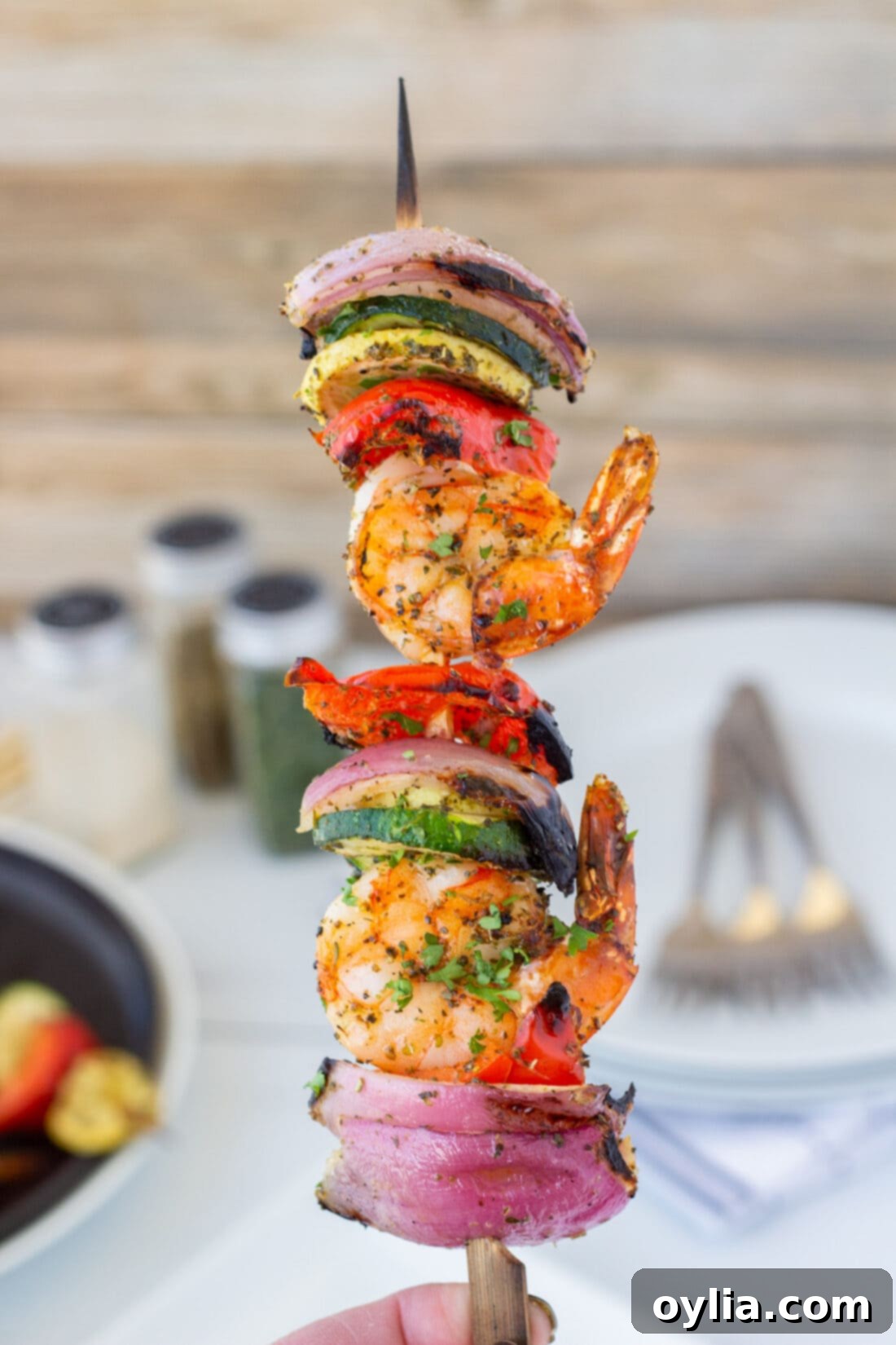 Shrimp Kabob with seasonings in the background, highlighting the fresh ingredients and spices.