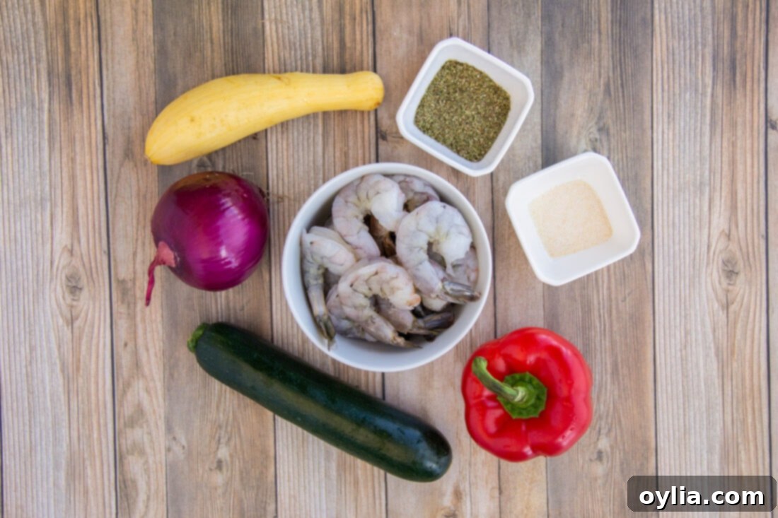 Fresh ingredients laid out for making Shrimp Kabobs, including raw shrimp, chopped vegetables, and seasonings.