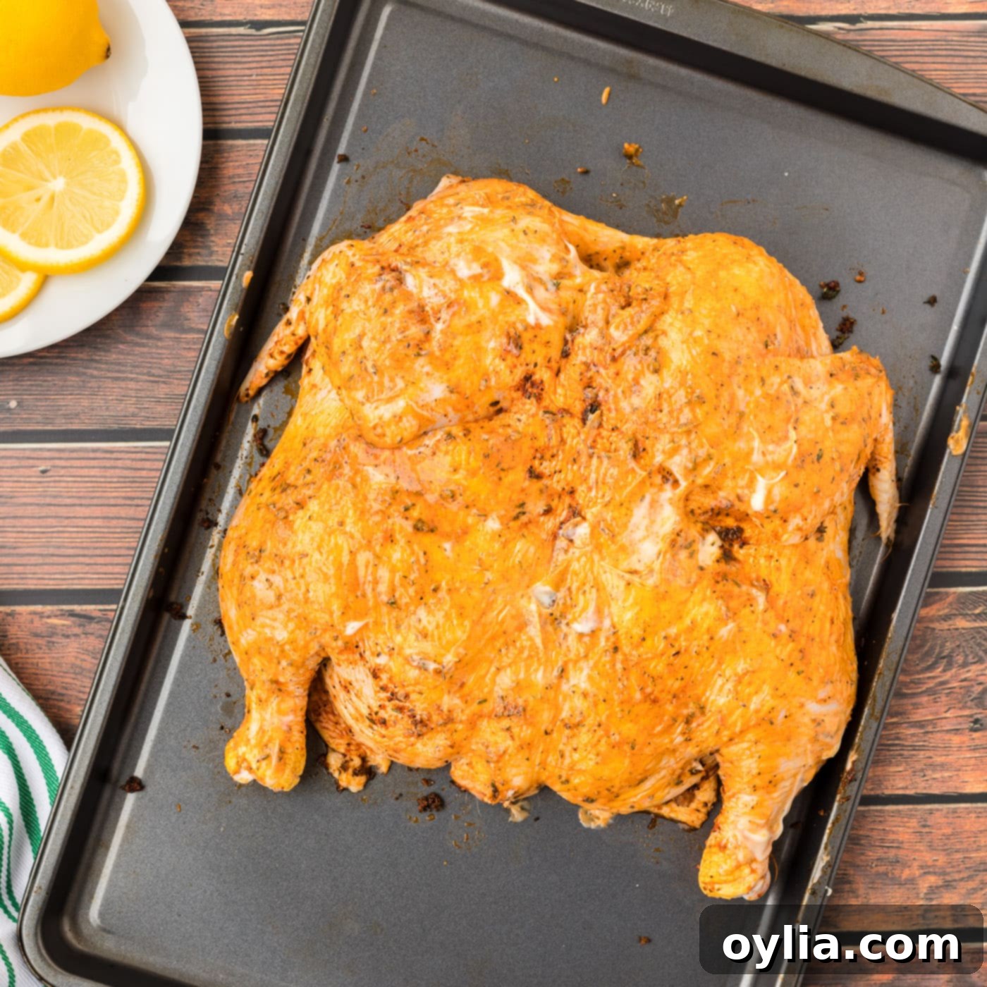 spatchcock chicken on a baking tray